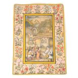 A 19TH CENTURY UDAIPUR SCHOOL INDIAN MINIATURE WATERCOLOUR with colourful floral border 32.5cm