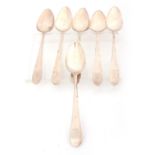 A SET OF SIX GEORGE III IRISH SILVER DESSERT SPOONS with engraved stag head crests to the handles,