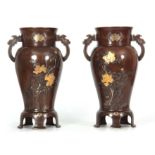 A PAIR OF JAPANESE MEIJI PERIOD INLAID MIXED METAL PATINATED BRONZE VASES decorated with