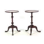 A PAIR OF GOERGE III MAHOGANY WINE TABLES with pie crust moulded edge tops, on vase-shaped ring