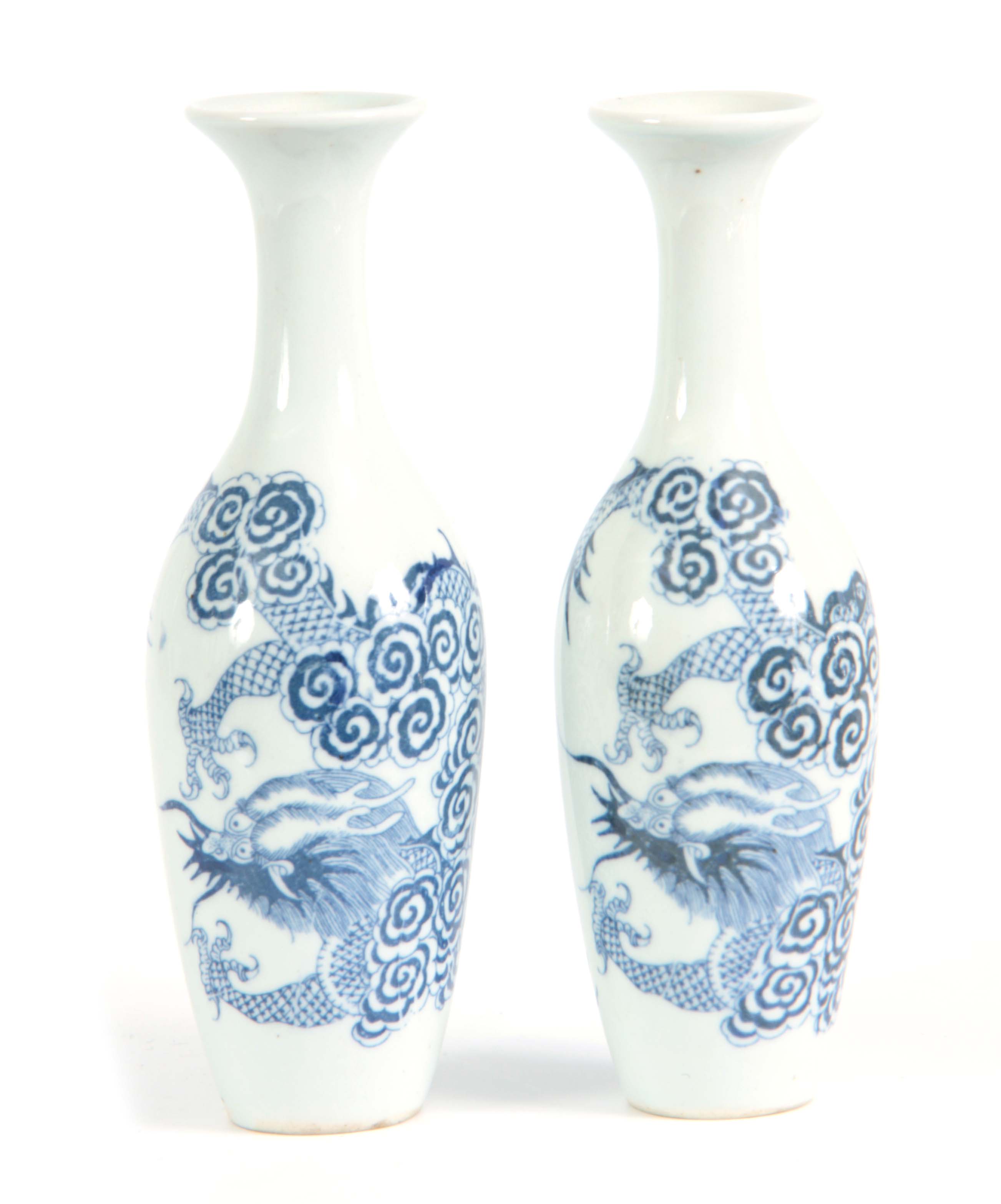 A SLENDER PAIR OF SMALL 18TH/19TH CENTURY CHINESE BLUE AND WHITE VASES decorated with dragons 20cm