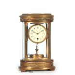 A FRENCH CLAUDE GRIVOLAS OVAL CASED 400 DAY TORSION MANTEL CLOCK the oval case with reeded column