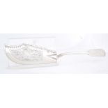AN EARLY VICTORIAN SILVER FIDDLE PATTERN FISH SLICE with finely engraved and pierced decoration