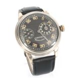 A CORTEBERT REGULATEUR WRIST WATCH the large steel case enclosing a black radium dial with