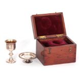 A GEORGE IV SILVER COMMUNION SET IN ORIGINAL MAHOGANY BOX comprising chalice and paten both with