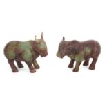 A PAIR OF ORIENTAL CARVED RUST JADE WATER BUFFALO 12cm across 9.5cm and 8.5cm high