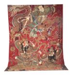 AN 18TH/19TH CENTURY CHINESE WALL HANGING TAPESTRY with mask head and entwined dragon 295cm high