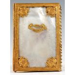 AN EARLY 19TH CENTURY FRENCH MOTHER OF PEARL AND ORMOLU SOUVENIR NOTE PAD from the hotel CHEATUE