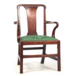 AN EARLY 18TH CENTURY WALNUT OPEN ARMCHAIR with tapering vase shaped back splat , shepherd's crook