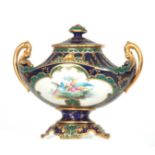 AN ORNATE ROYAL CROWN DERBY GILT TWO-HANDLED BOAT-SHAPED PEDESTAL CABINET VASE AND COVER of fanned