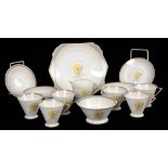 AN ART DECO PORCELAIN TEA SET with painted floral decoration