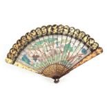 A FINE QING DYNASTY CHINESE GILT DECORATED BLACK LACQUERED IVORY FAN with brightly coloured panels