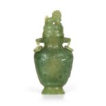 A 19th CENTURY CHINESE JADE VASE AND COVER of baluster form with shallow carved decoration to the