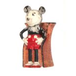 A RARE EARLY CROWN DEVON VASE modelled as Mickey Mouse seated in a wicker chair, painted with red