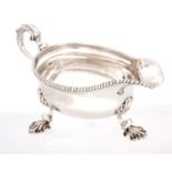 A GEORGE III SCOTTISH SILVER SAUCE BOAT having an oval bulbous body with gadrooned rim and