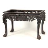 A 19TH CENTURY CHINESE CARVED HARDWOOD SERVING/ALTAR TABLE with missing marble to the top above an