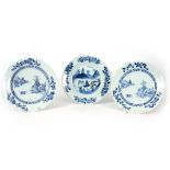 THREE 18TH CENTURY CHINESE BLUE AND WHITE PLATES decorated with town scenes 23cm diameter.