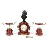 A LATE 19TH CENTURY FRENCH BRONZE AND ROUGE MARBLE CLOCK GARNITURE the cylindrical column style