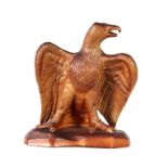 A LARGE 19th CENTURY SALT GLAZED SCULPTURE OF A STANDING EAGLE with wings spread 55cm high 47cm