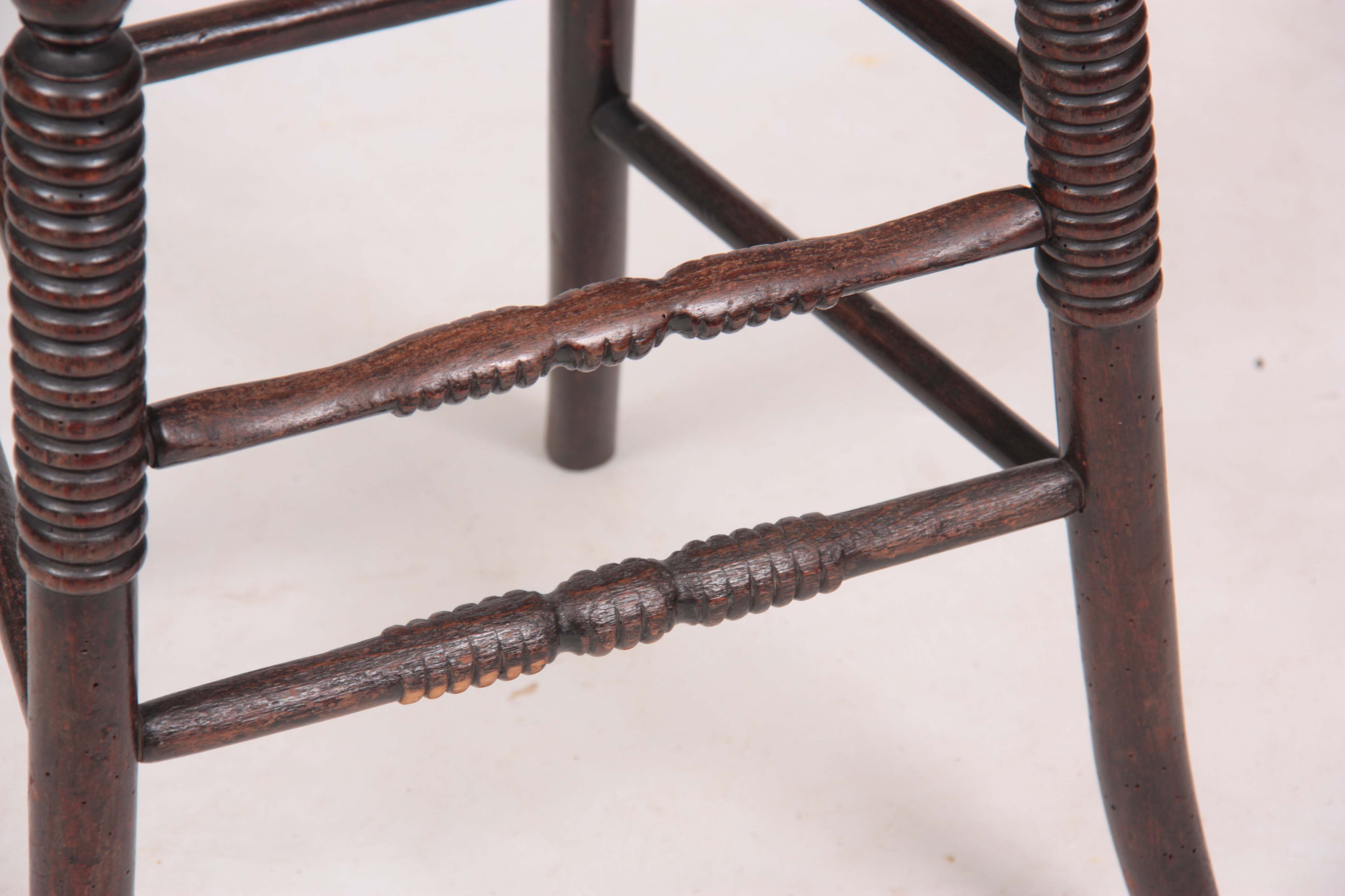 A 19TH CENTURY LATE REGENCY SIMULATED ROSEWOOD STAINED BEECH CHILD'S CORRECTION CHAIR with lyre- - Image 4 of 5