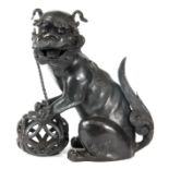 A CHINESE 18TH / 19TH CENTURY CAST BRONZE SCULPTURE OF A SEATED FOO DOG WITH A BALL 34.5cm high 33cm