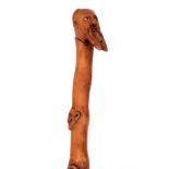 AN UNUSUAL LATE 19TH CENTURY FOLK ART WALKING STICK with a bearded man to the top and several