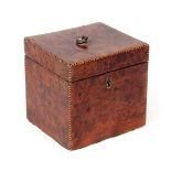 A GEORGE III SQUARE BURR YEW-WOOD TEA CADDY with boxwood and ebony stringing, the hinged lid