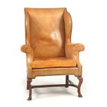 A QUEEN ANNE AND LATER GENTLEMAN'S WINGBACK ARMCHAIR with tan leather upholstery, the square back