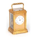 A 19TH CENTURY FRENCH GILT BRASS ENGRAVED GORGE CASE CARRIAGE CLOCK REPEATER with folding handle and