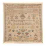 A 19TH CENTURY NEEDLEWORK SAMPLER BY HANNAH DIBB AGED 7 YEARS having stitched alphabet, flowers,