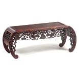A 19TH CENTURY CHINESE ROSEWOOD ALTAR TABLE with panelled top above a geometric carved frieze