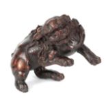 A 18TH/19TH CENTURY CHINESE CARVED WOOD SCULPTURE modelled as a Foo dog 11.5cm high
