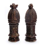 A PAIR OF EARLY POLYCHROME CARVED NEWEL POSTS constructed in block form, decorated with fish