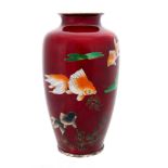A JAPANESE RED CLOISONNE VASE decorated with goldfish and Lilly pads 18.5cm high