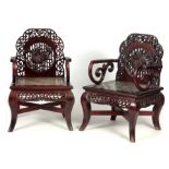 A PAIR OF EARLY/MID 20TH CENTURY CHINESE HARDWOOD OPEN ARMCHAIRS the openwork panelled back within