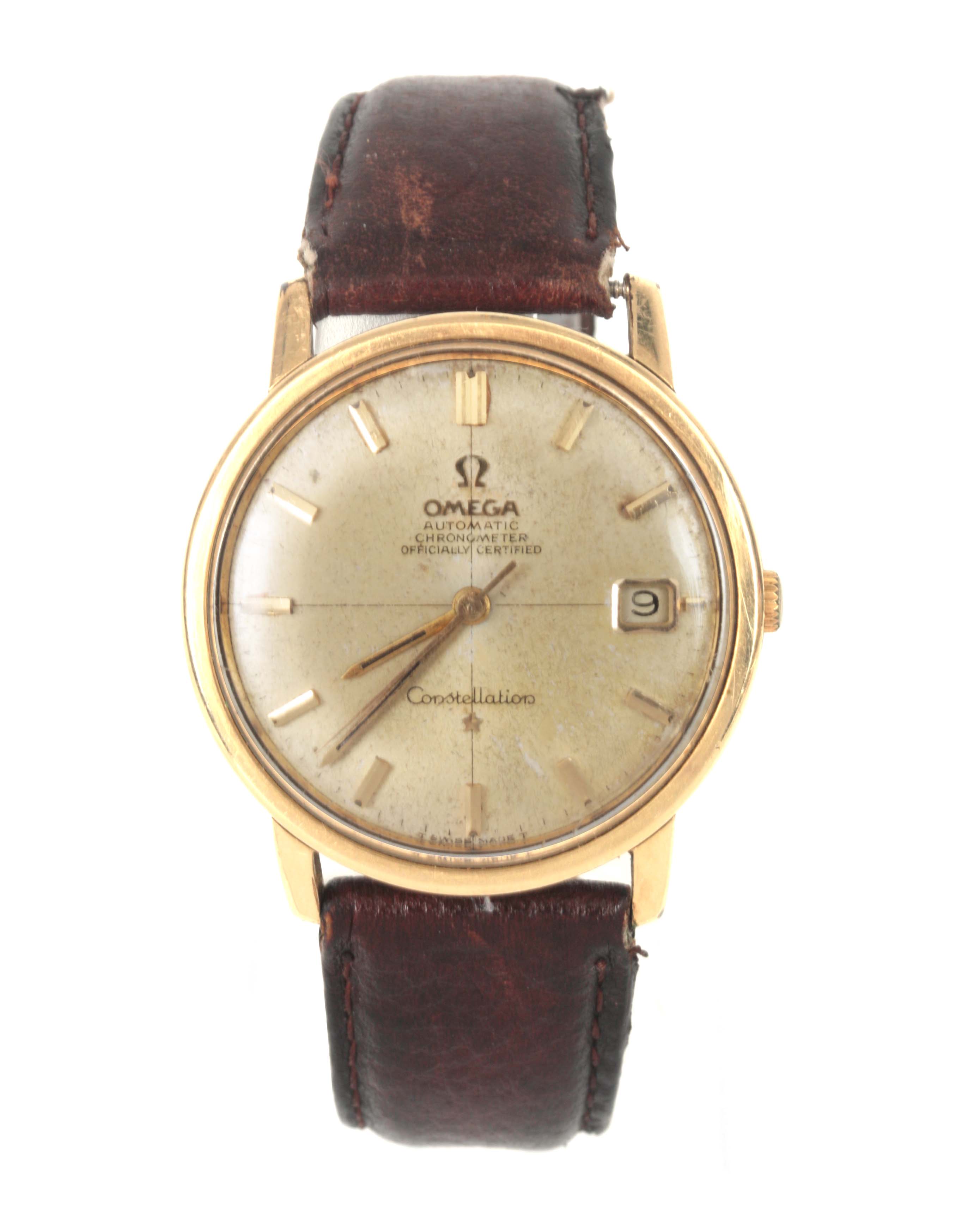 A MID 20TH CENTURY GENTLEMAN'S STEEL AND GOLDPLATED OMEGA CONSTELLATION WRISTWATCH on a brown