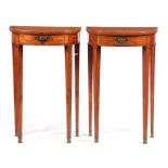 A PAIR OF EDWARDIAN INLAID SATINWOOD DEMI LUNE SIDE TABLES with ebony inlaid and cross-banded tops