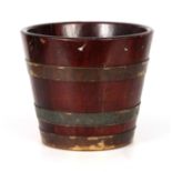 A LATE GEORGIAN MAHOGANY BRASS BOUND BUCKET of coopered tapering form 30cm diameter 26cm high.