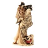 A VERY FINE QUALITY SIGNED JAPANESE MEIJI PERIOD TOKYO SCHOOL IVORY OKIMONO modelled as a Geisha