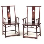 A PAIR OF CHINESE HARDWOOD OPEN ARMCHAIRS with square-topped back above panelled seats and turned