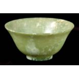 A CHINESE GREEN AND WHITE JADE BOWL 12cm diameter 5.5cm high