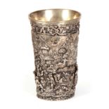 A 19TH CENTURY EUROPEAN SILVERED BRONZE BEAKER decorated with relief moulded figures in a