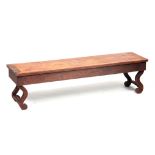 A 19TH CENTURY CHINESE HARDWOOD WINDOW SEAT / ALTAR TABLE with reeded front rail and shaped end