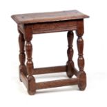 A LATE 17TH CENTURY OAK JOINT STOOL, having a six peg rectangular moulded top on turned legs with