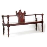 A WILLIAM IV MAHOGANY HALL BENCH having a shaped carved central panel to the back joined by turned