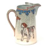 A CECIL ALDIN ROYAL DOULTON HUNTING JUG decorated with hounds and foxes mask 16.5cm high