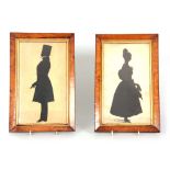 A PAIR OF 19TH CENTURY SILHOUETTES depicting a lady and gentleman inscribed on the reserve "C. 1835"