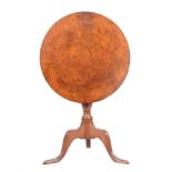AN UNUSUAL 18TH CENTURY BURR WALNUT AND OAK TRIPOD TABLE with tilt top on a turned stem and cabriole