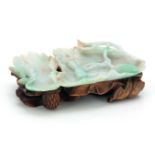 A 19TH CENTURY CHINESE JADE CARVED SHALLOW DISH carved as one large and one small lotus leaf with