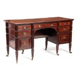 AN UNUSUAL EARLY 19th CENTURY MAHOGANY DESK having outset reeded columns and fitted with graduated